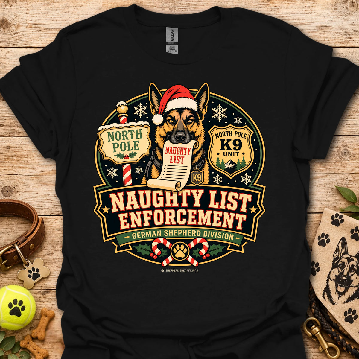 Black T-shirt with holiday dog badge graphic, Santa hat and paw print details