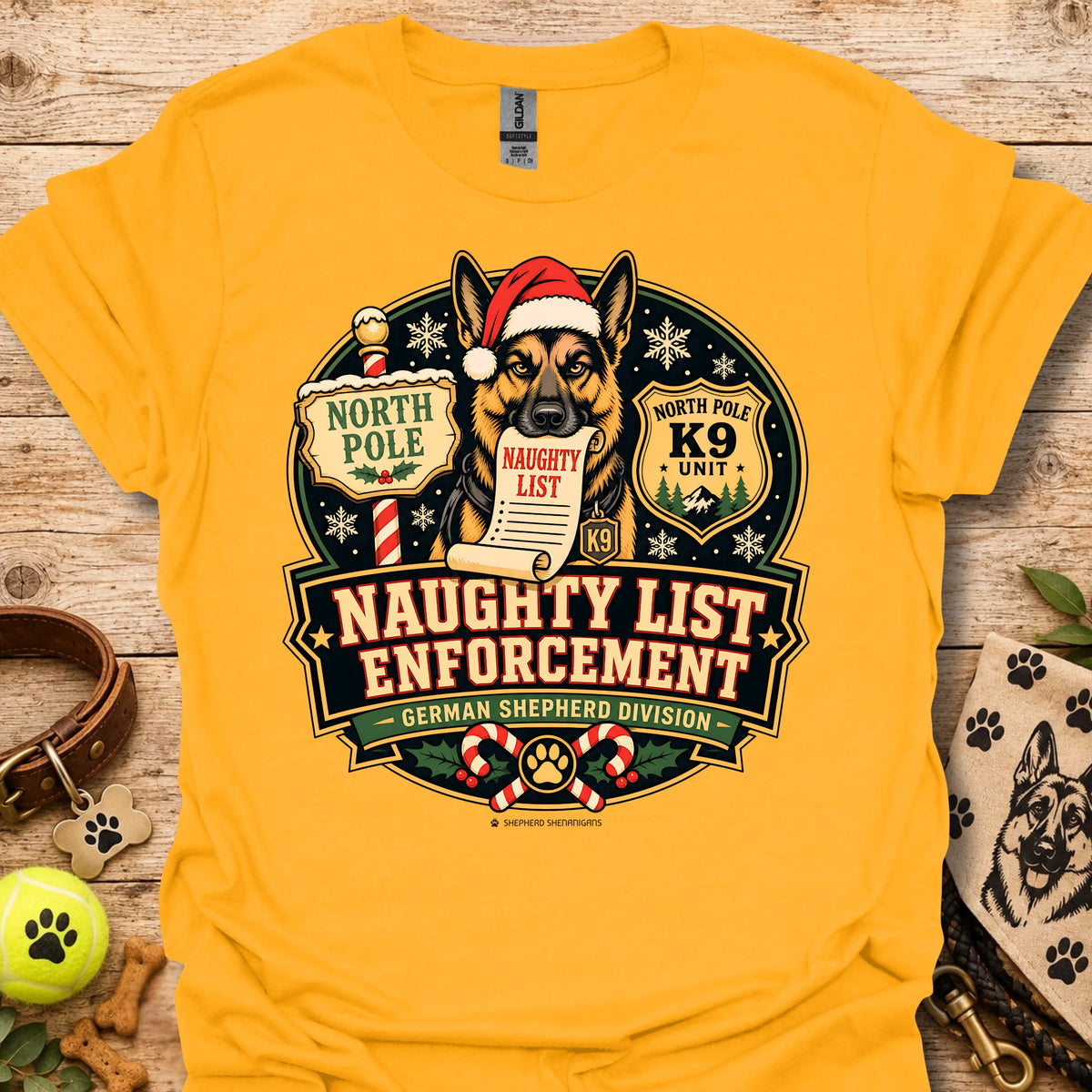 Gold T-shirt with holiday dog badge graphic, Santa hat and paw print details