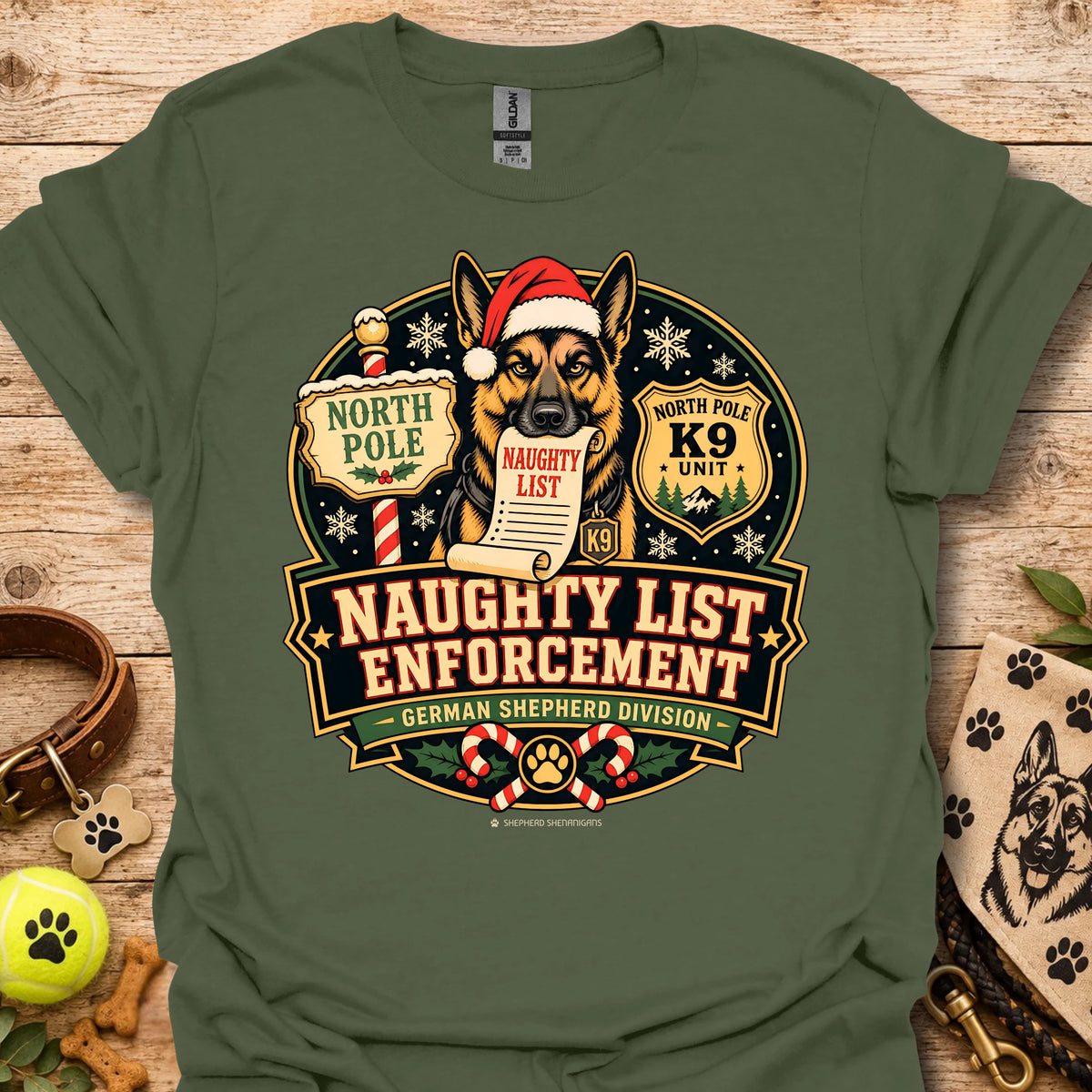 Military green T-shirt with holiday dog badge graphic, Santa hat and paw print details