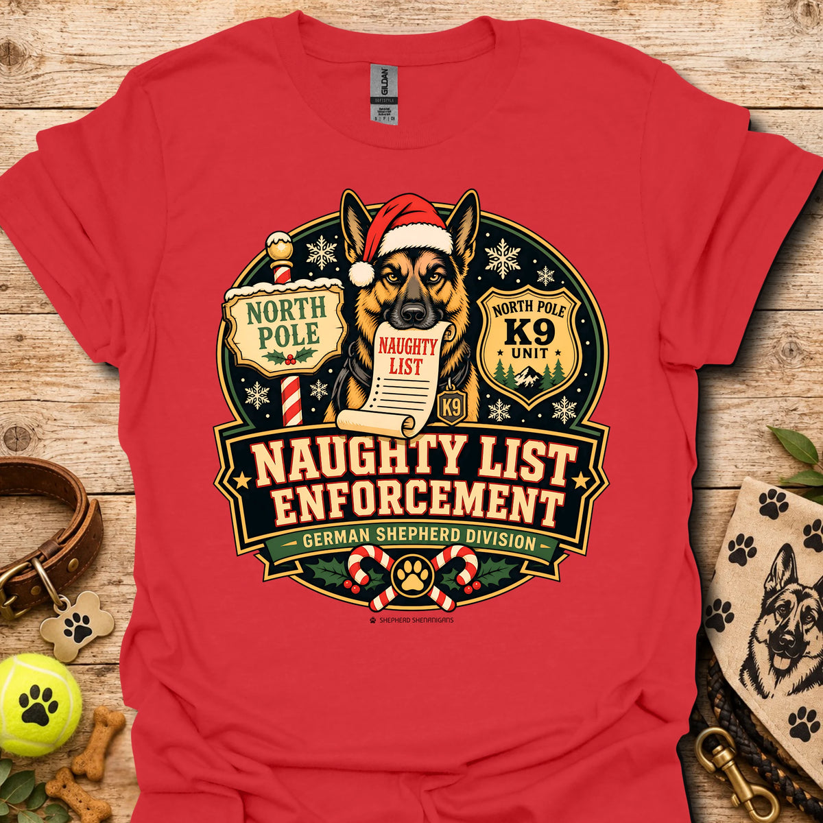 Red T-shirt with holiday dog badge graphic, Santa hat and paw print details