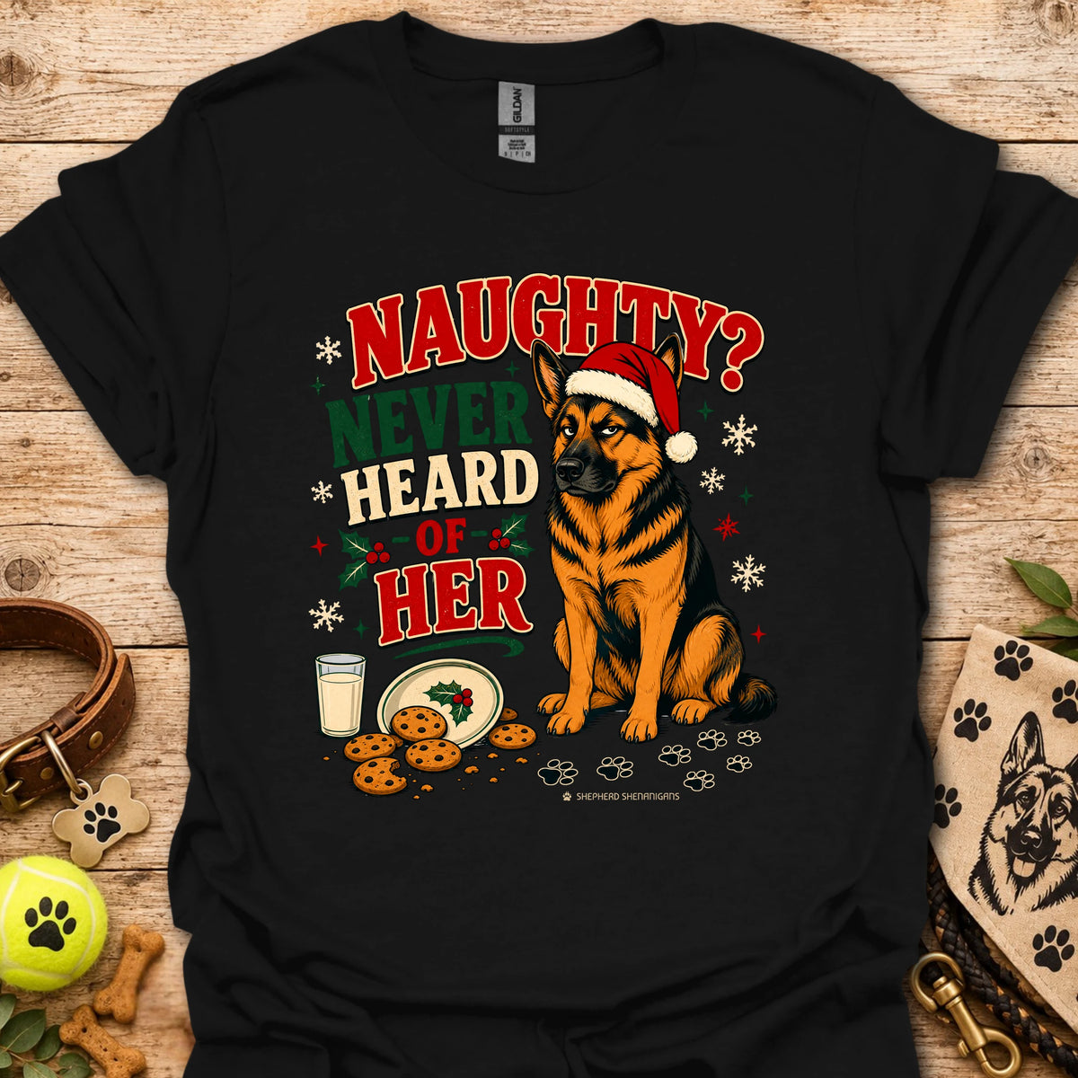 Black graphic t-shirt with holiday dog in Santa hat and 'Naughty? Never Heard of Her' text