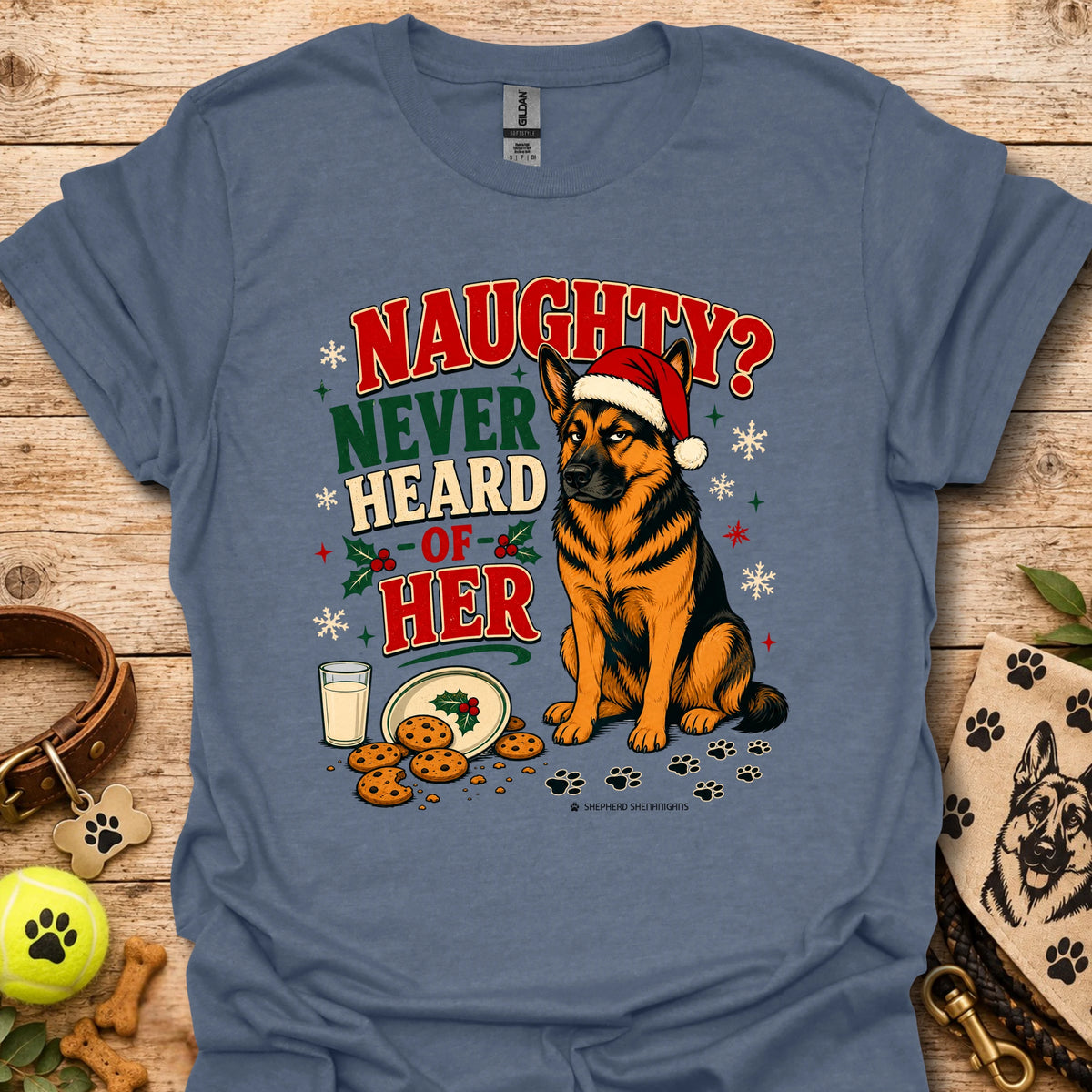 Heather indigo graphic t-shirt with dog in Santa hat and 'Naughty? Never Heard of Her' text