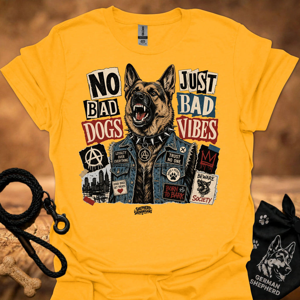 Gold graphic t-shirt with German shepherd and text 'No Bad Dogs, Just Bad Vibes'.
