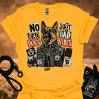 Gold graphic t-shirt with German shepherd and text 'No Bad Dogs, Just Bad Vibes'.