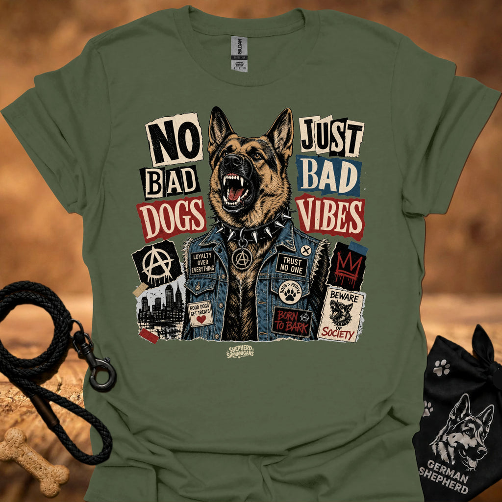 Military green graphic t-shirt with German shepherd and text 'No Bad Dogs, Just Bad Vibes'.