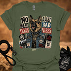 Military green graphic t-shirt with German shepherd and text 'No Bad Dogs, Just Bad Vibes'.