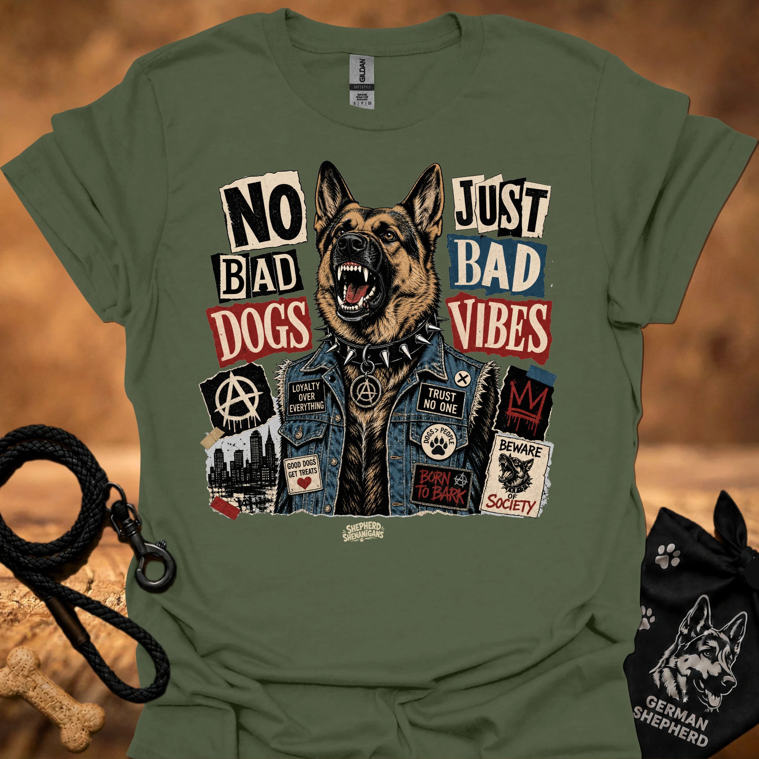 Military green graphic t-shirt with German shepherd and text 'No Bad Dogs, Just Bad Vibes'.