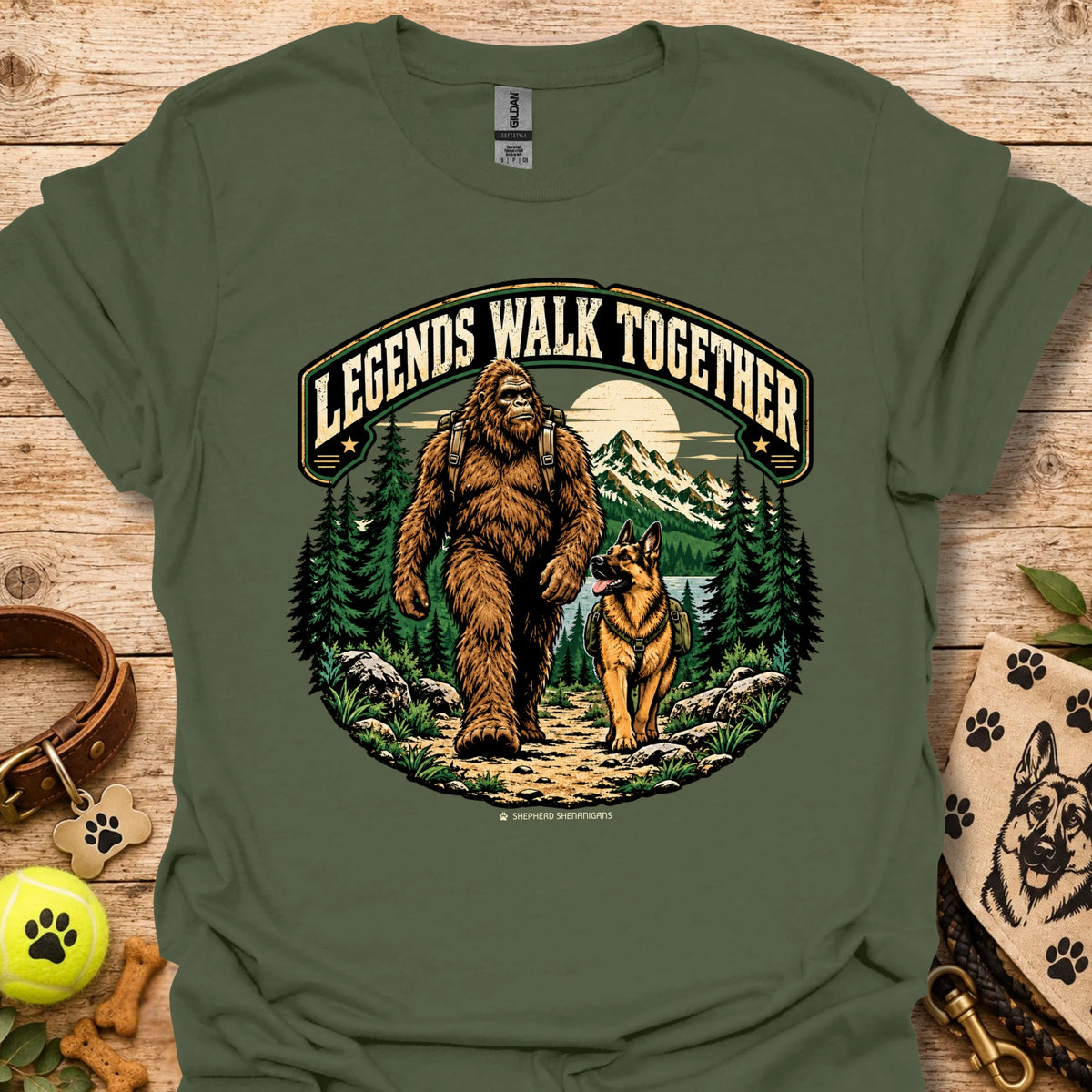 Military green T-shirt with circular bear and dog graphic in woodland