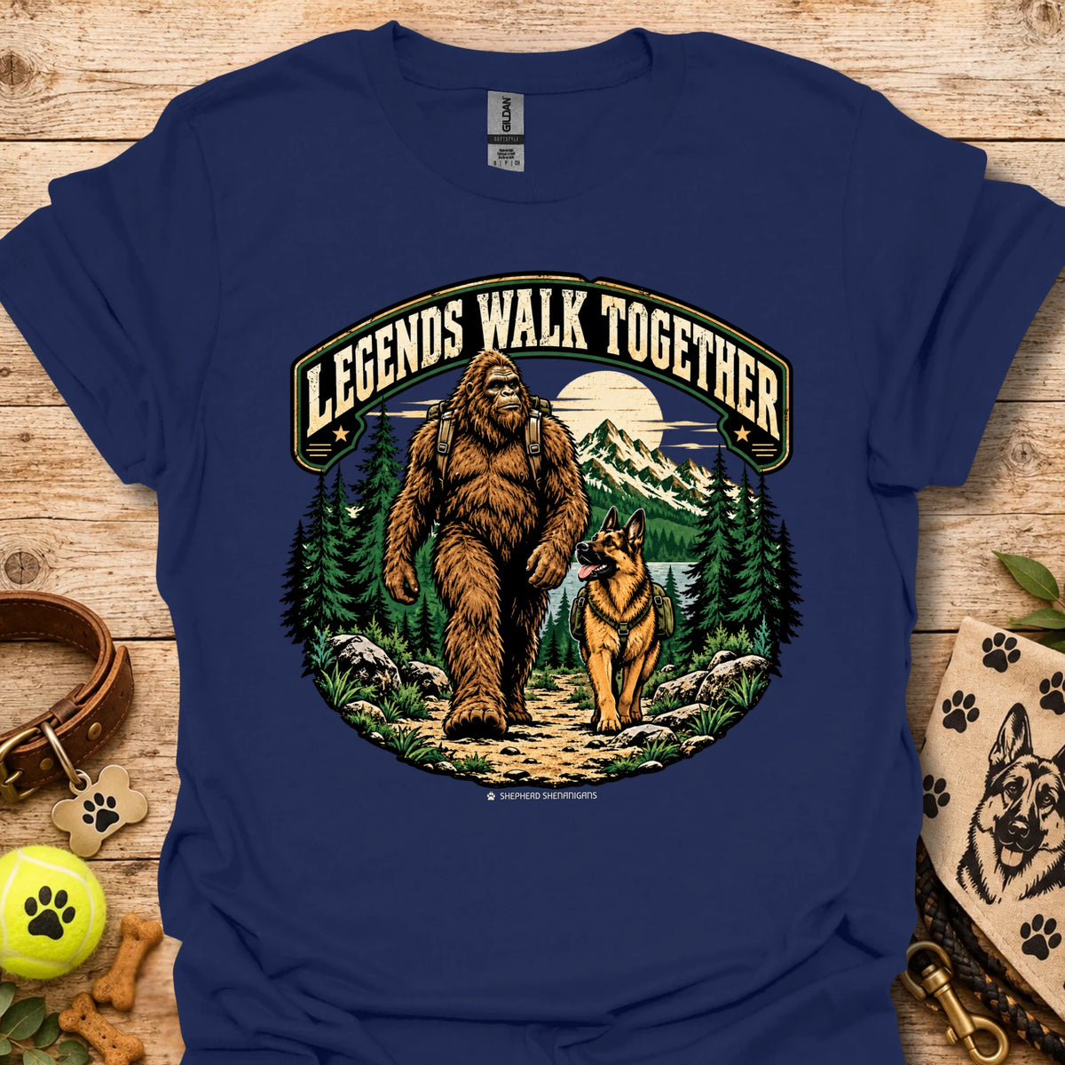 Navy T-shirt with circular bear and dog illustration framed by trees