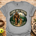 Light gray T-shirt with circular bear and dog graphic surrounded by trees