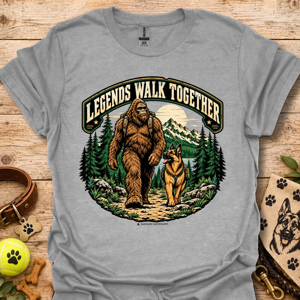 Light gray T-shirt with circular bear and dog graphic surrounded by trees