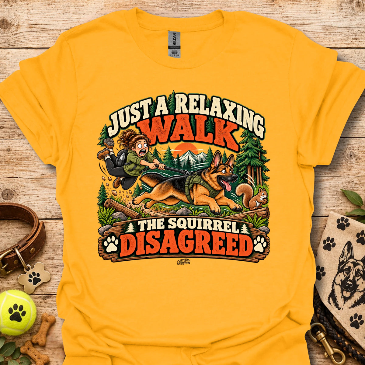 Gold crew-neck t-shirt with colorful 'Just a Relaxing Walk' and squirrel graphic