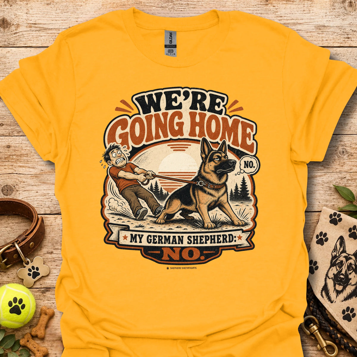 Gold T-shirt with German shepherd graphic and 'WE'RE GOING HOME' print