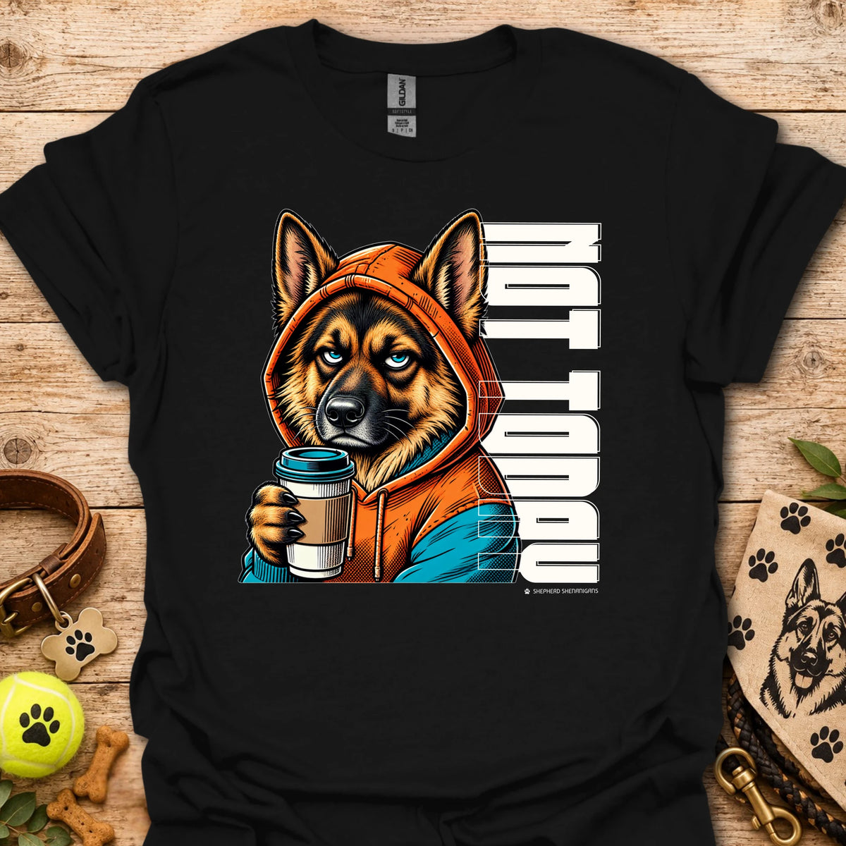 Black crewneck t-shirt with orange dog holding coffee cup graphic.