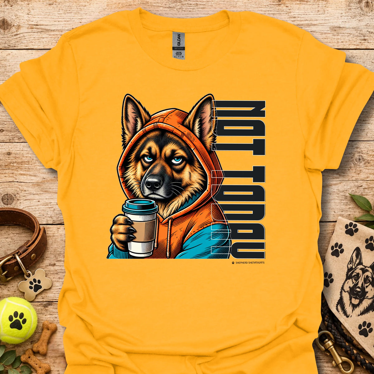 Gold crewneck t-shirt with orange dog holding coffee cup graphic.