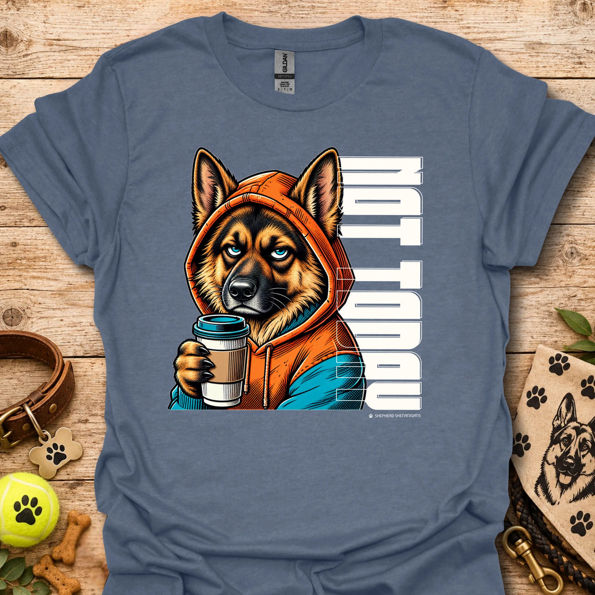 Heather blue crewneck t-shirt with orange dog holding coffee cup graphic.