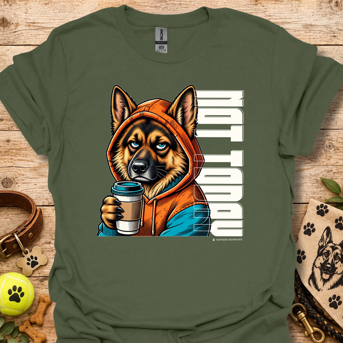 Military green crewneck t-shirt with orange dog holding coffee cup graphic.