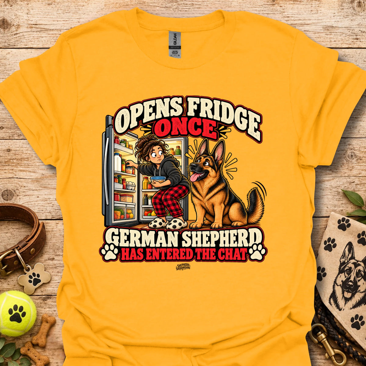 Gold crewneck t-shirt with “Opens Fridge Once” German shepherd chat front graphic.