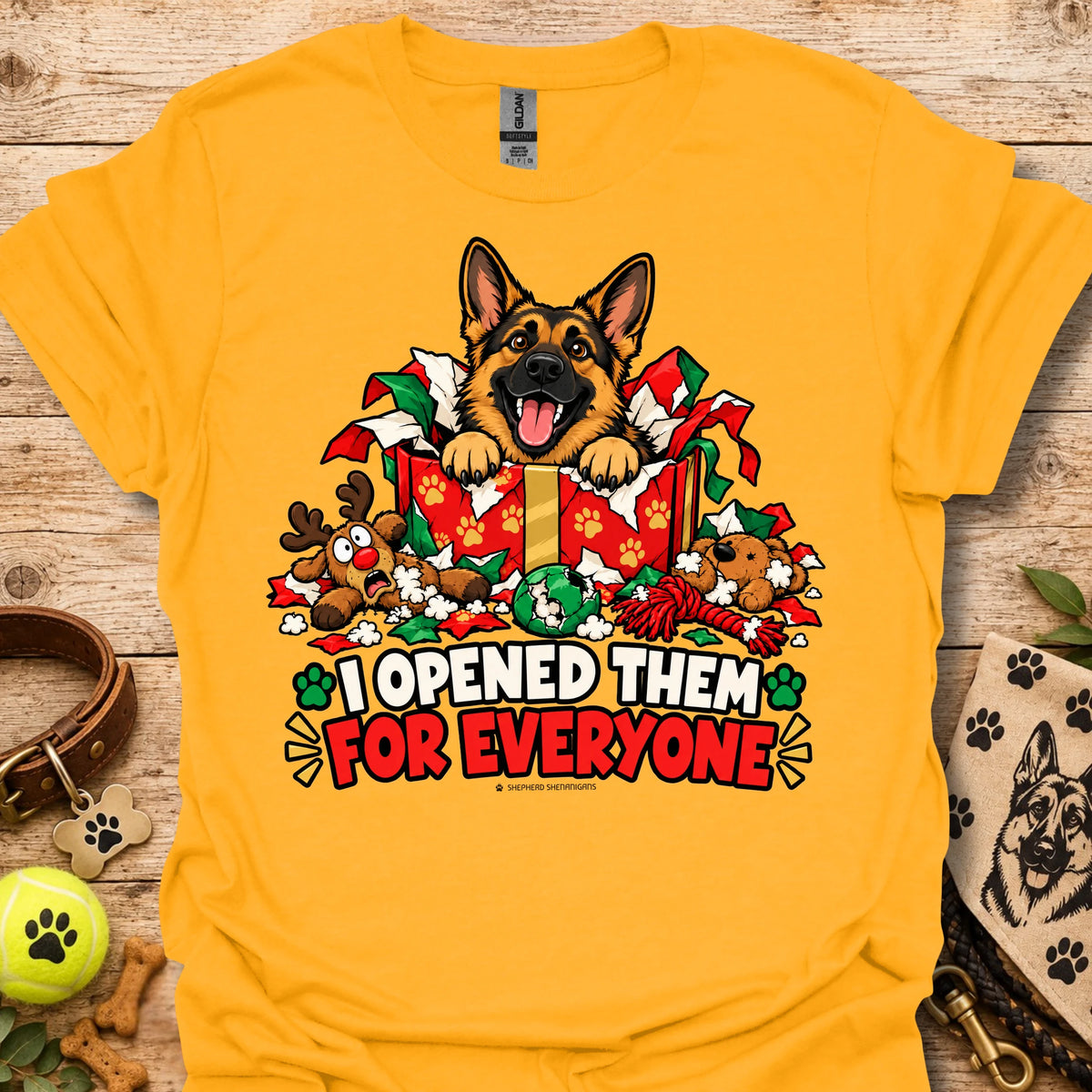 Gold crewneck T-shirt with dog holiday graphic and "I opened them for everyone" text