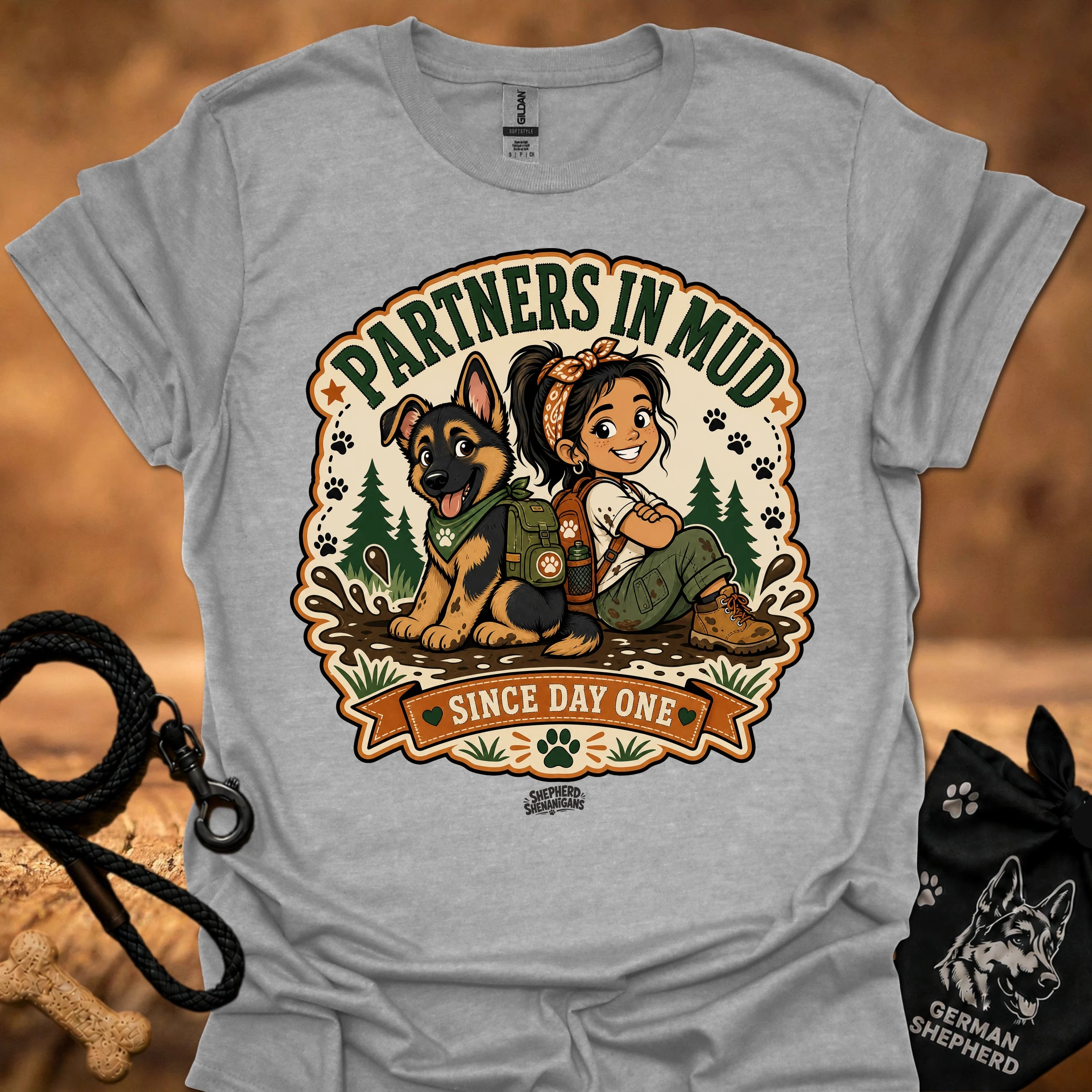 Sport gray women’s t-shirt with “Partners in Mud” dog and girl graphic centerpiece