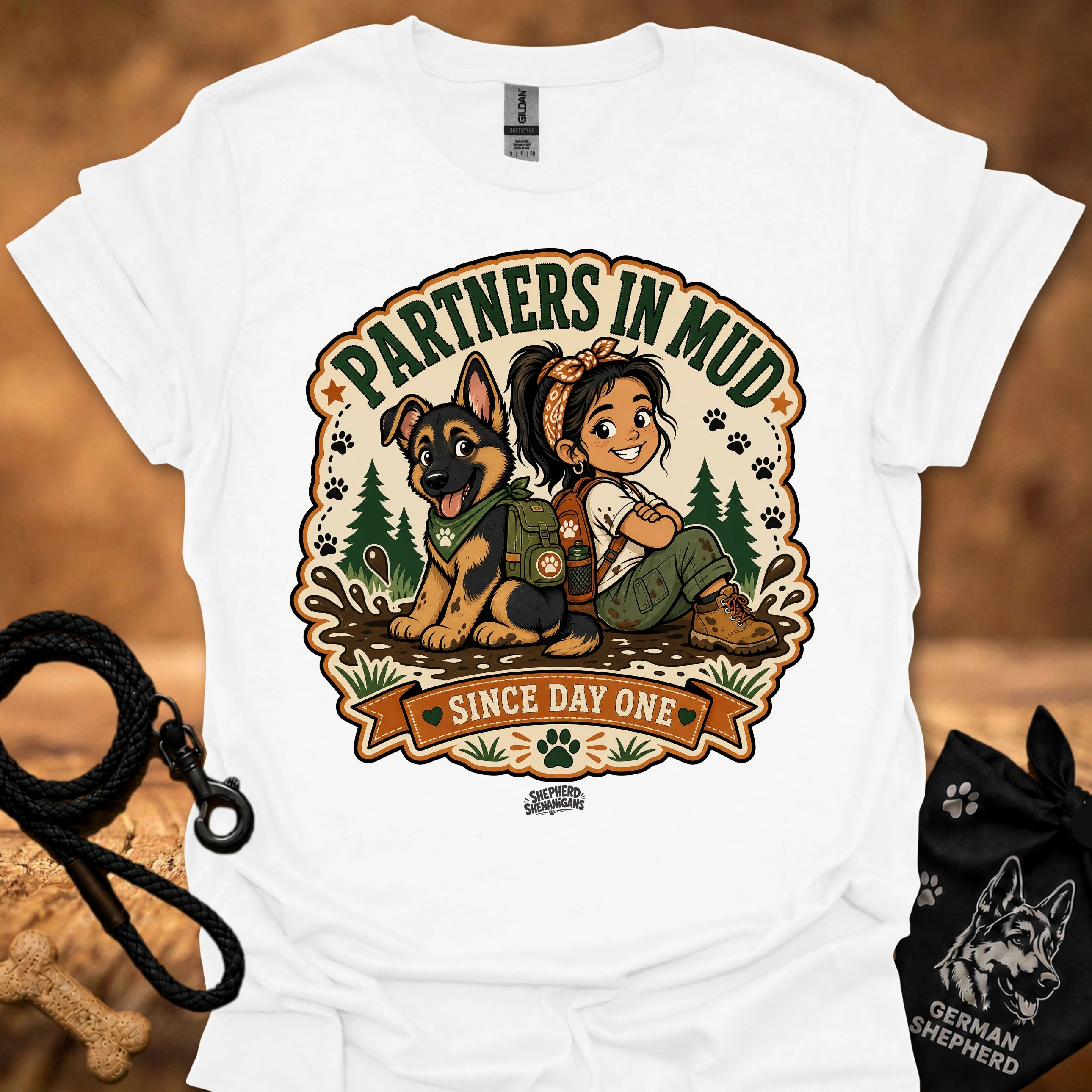 White women’s t-shirt with “Partners in Mud” dog and girl graphic and “Since Day One”