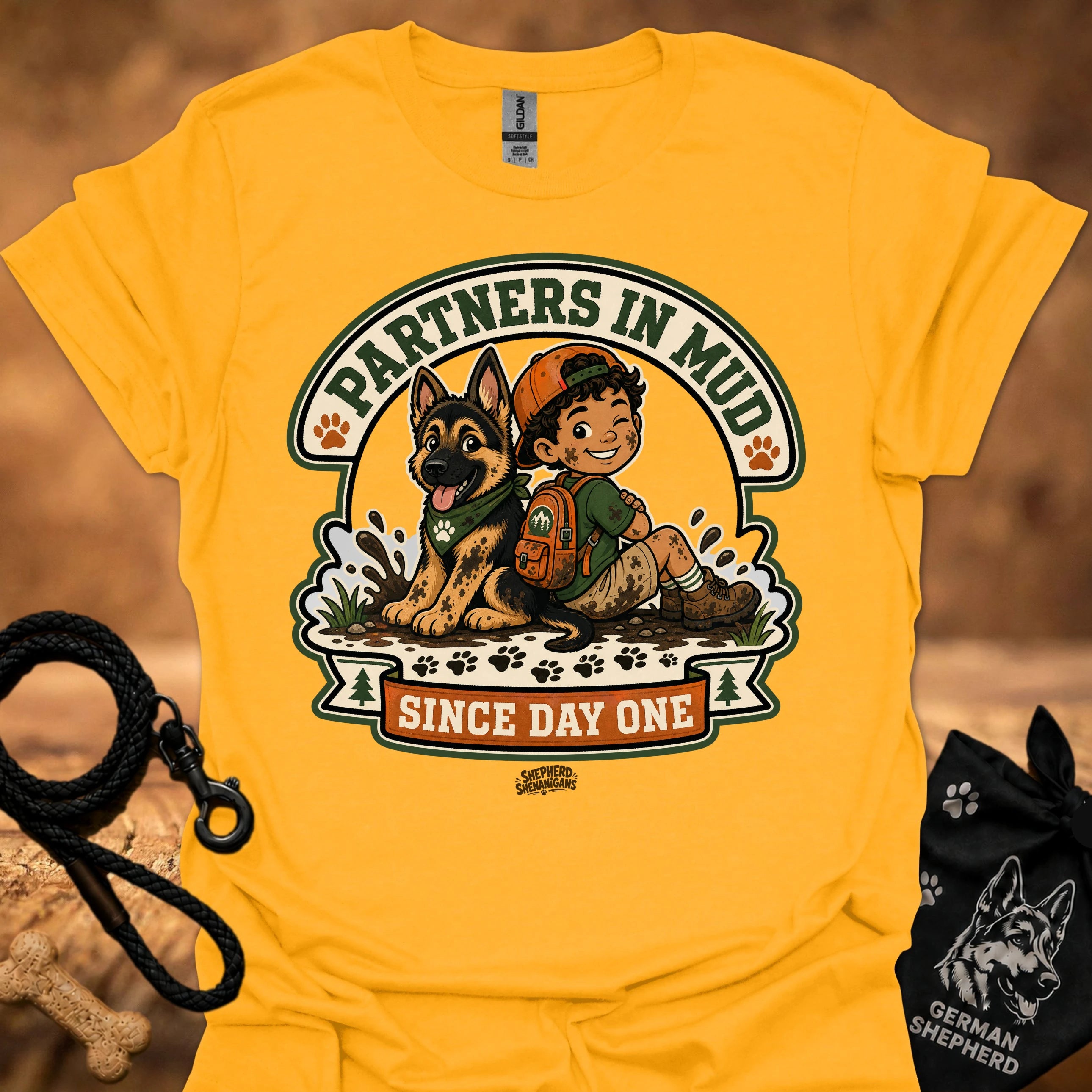 Gold men's t-shirt with circular dog and boy graphic, "Since Day One" print.
