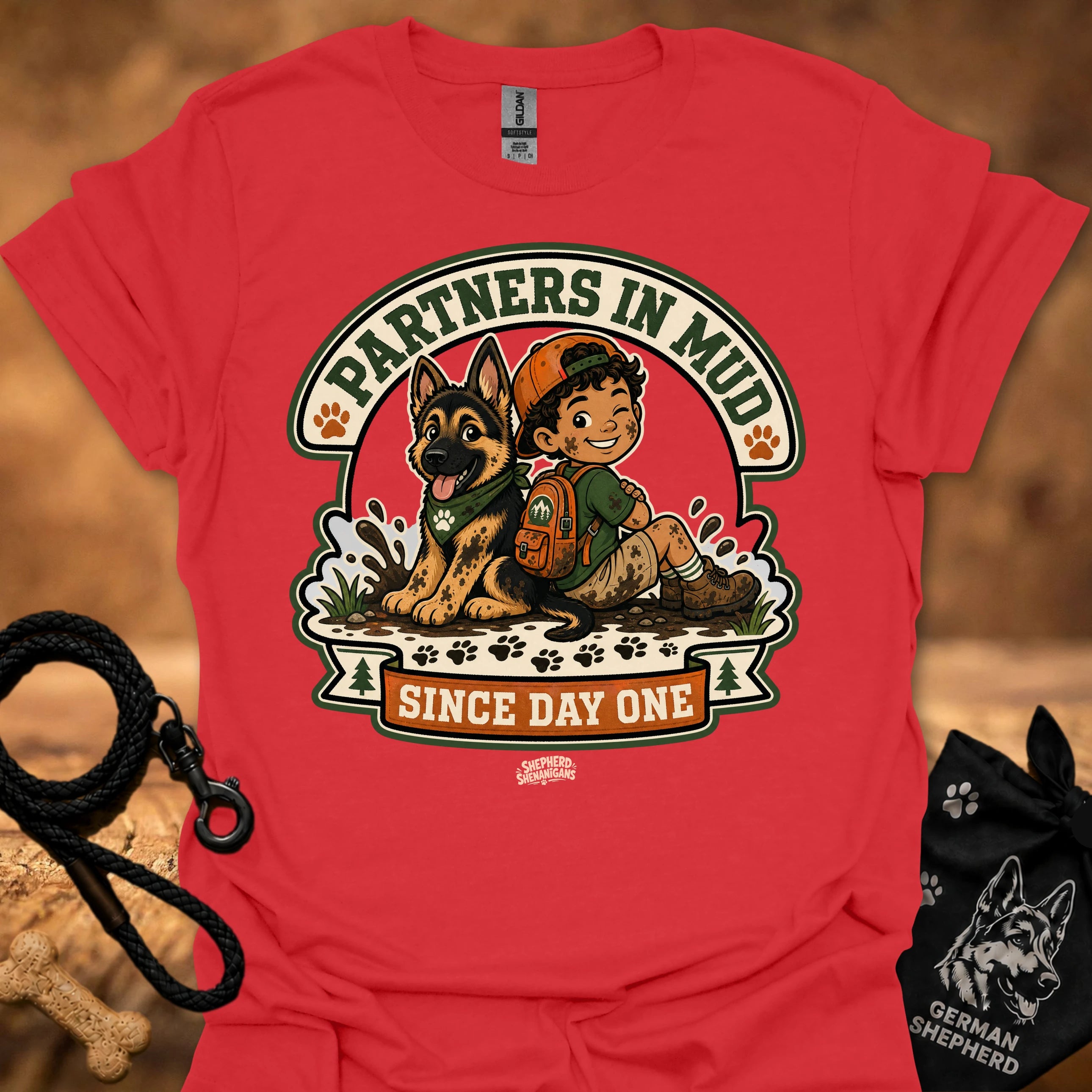 Red men's t-shirt with circular dog and boy graphic, "Since Day One" print.