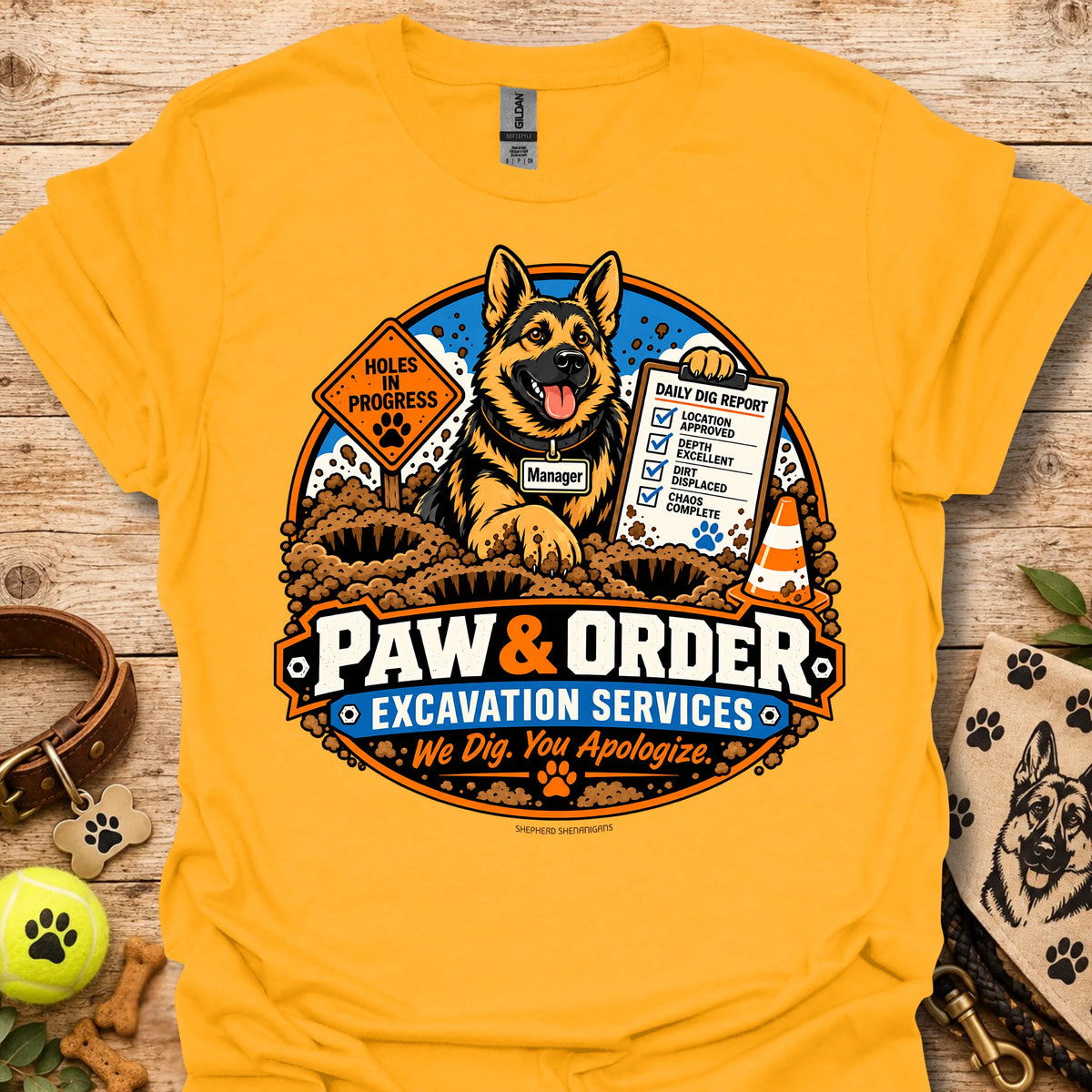 Gold/yellow Paw & Order excavation T-shirt with dog digging emblem and “We Dig You Apologize” text