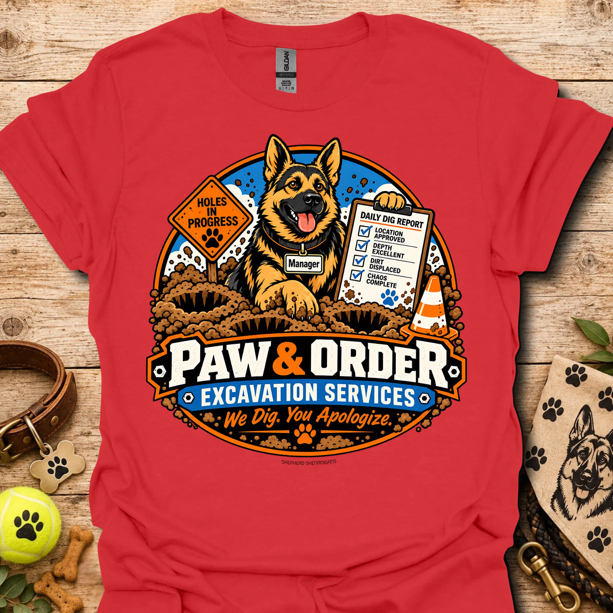 Red Paw & Order excavation T-shirt with dog digging emblem and “We Dig You Apologize” text