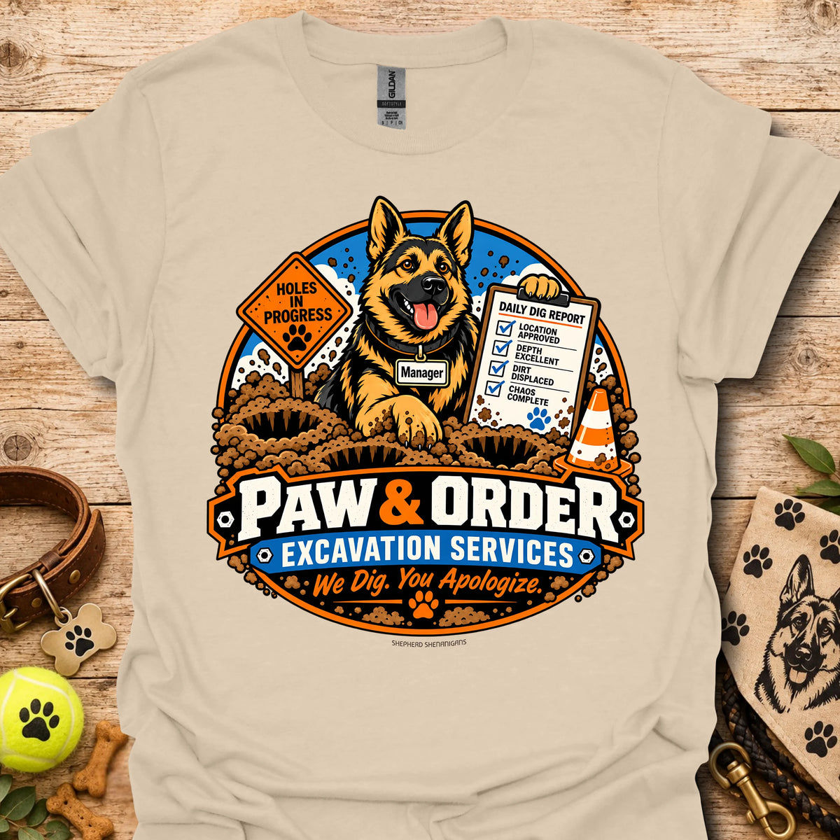 Sand Paw & Order excavation T-shirt with dog digging emblem and “We Dig You Apologize” text