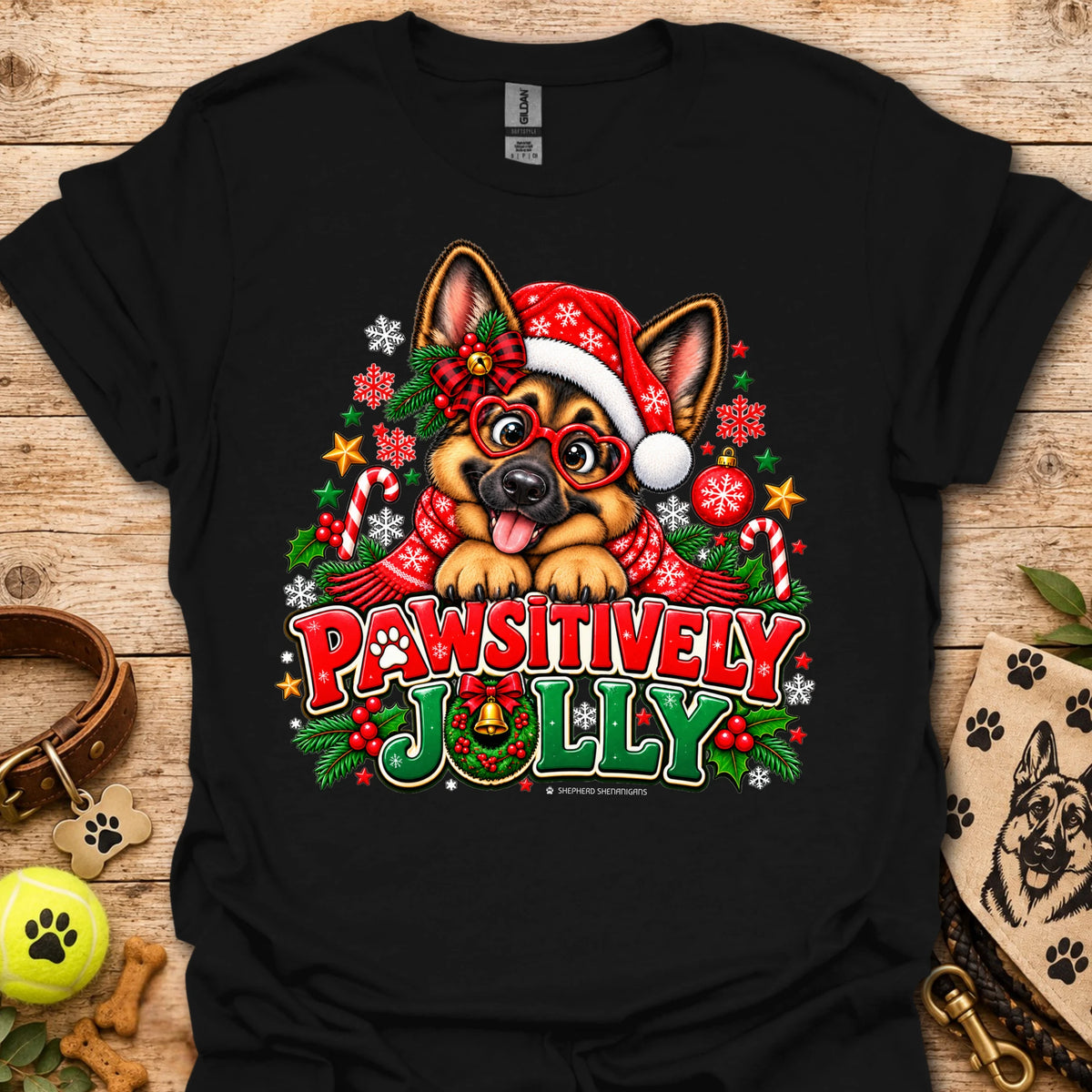 Black T-shirt with festive dog in Santa hat graphic and "Pawsitively Jolly" text