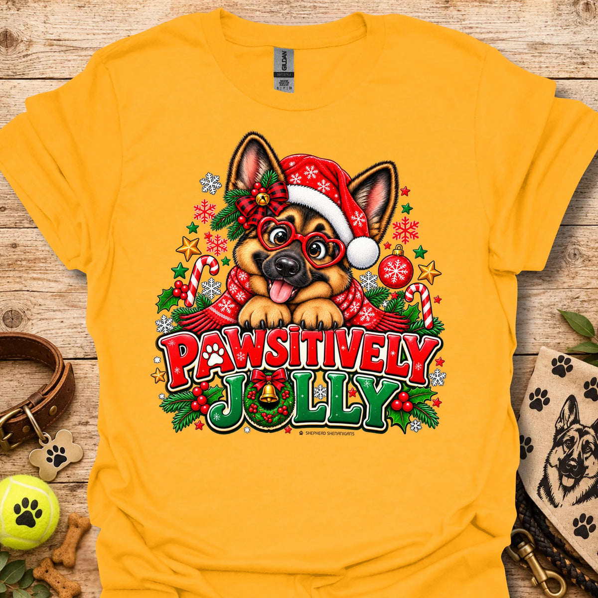 Gold/yellow T-shirt with festive dog in Santa hat graphic and "Pawsitively Jolly" text