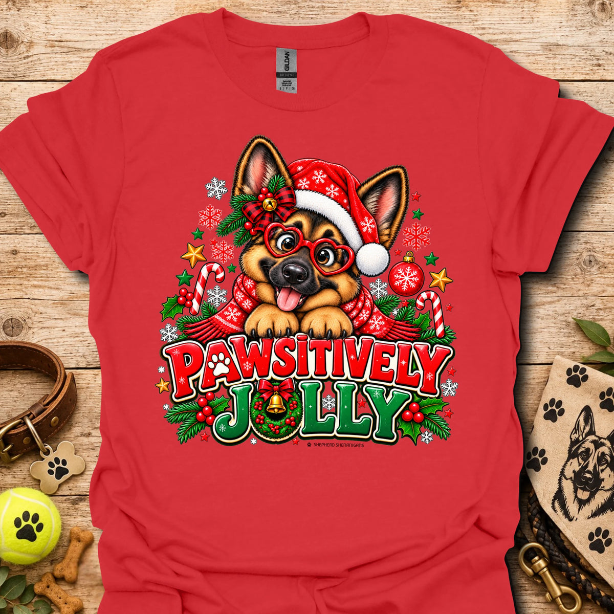 Red T-shirt with festive dog in Santa hat graphic and "Pawsitively Jolly" text