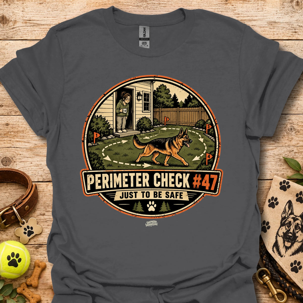Dark gray T-shirt with circular perimeter check graphic showing a dog and “Just to be safe”