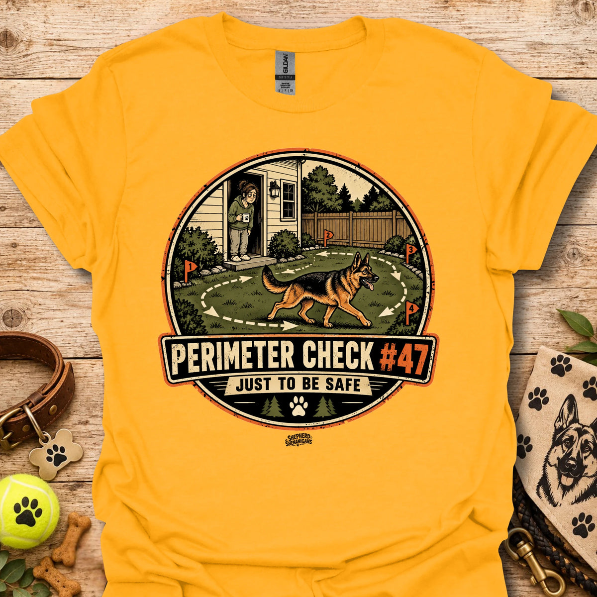 Gold/yellow T-shirt with circular perimeter check graphic showing a dog and “Just to be safe”