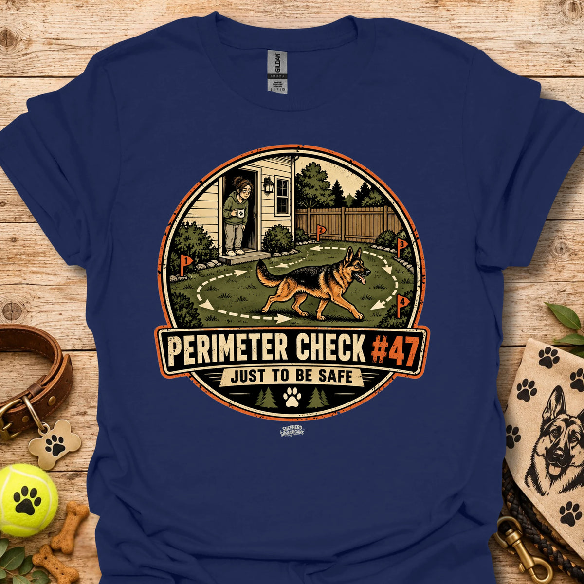 Navy T-shirt with circular perimeter check graphic showing a dog and “Just to be safe”