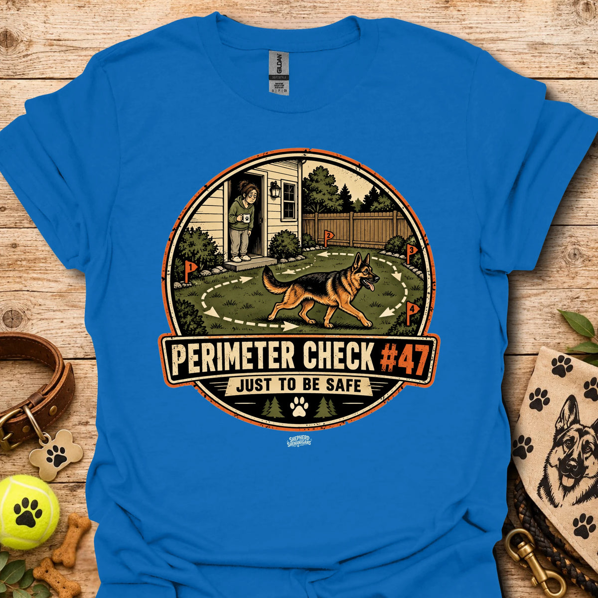 Royal blue T-shirt with circular perimeter check graphic showing a dog and “Just to be safe”