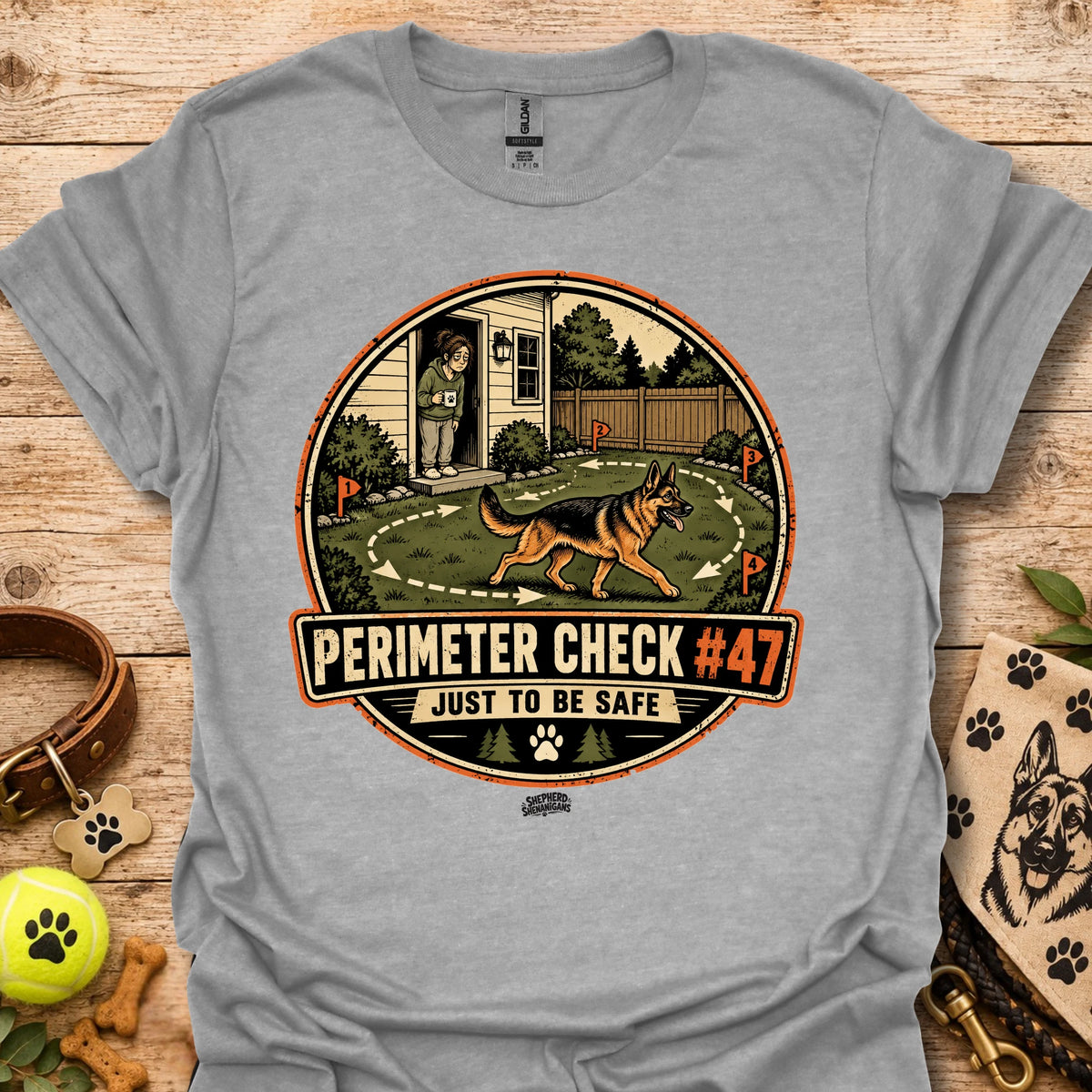Heather gray T-shirt with circular perimeter check graphic showing a dog and “Just to be safe”