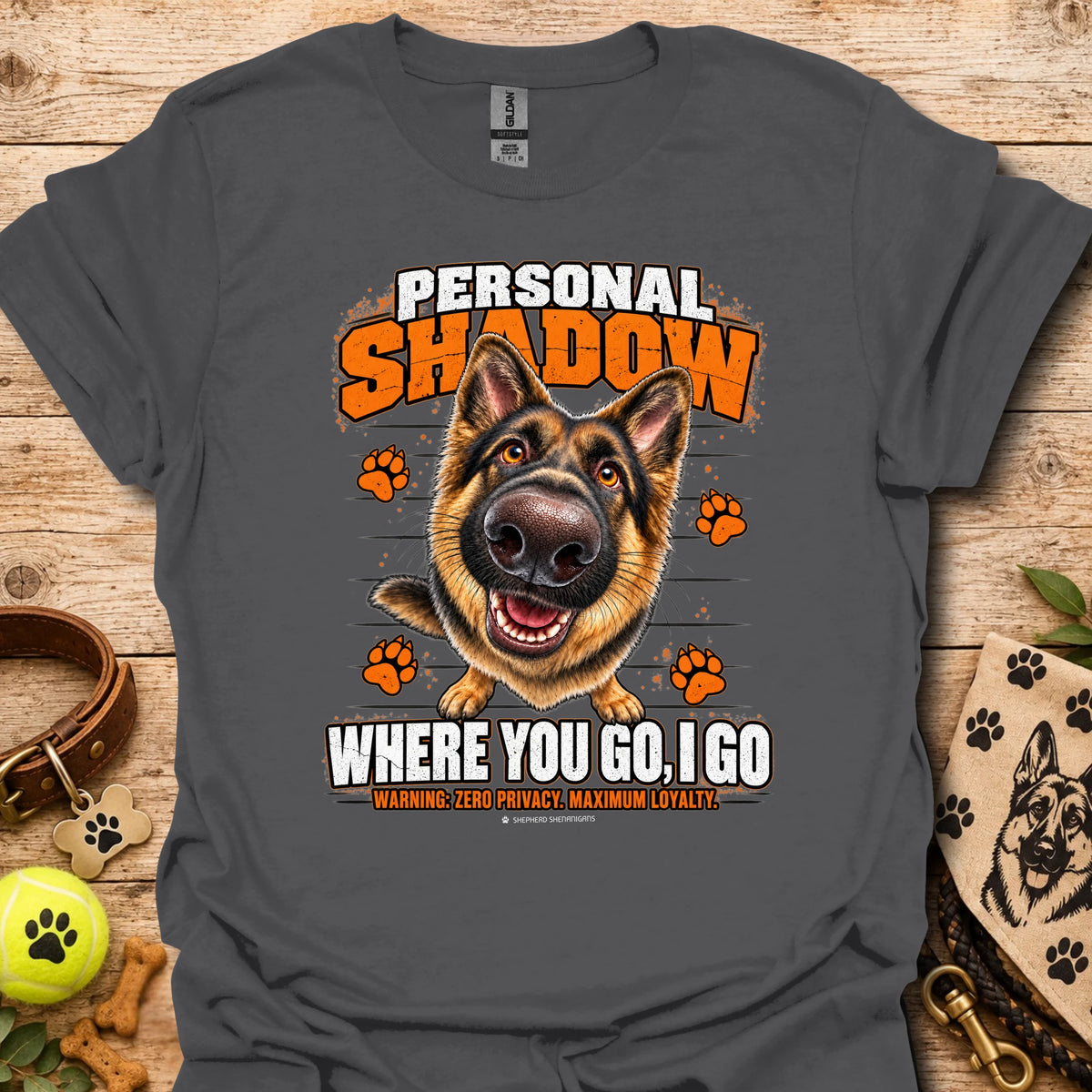 Charcoal T-shirt with a German shepherd graphic, orange paw prints and bold slogan