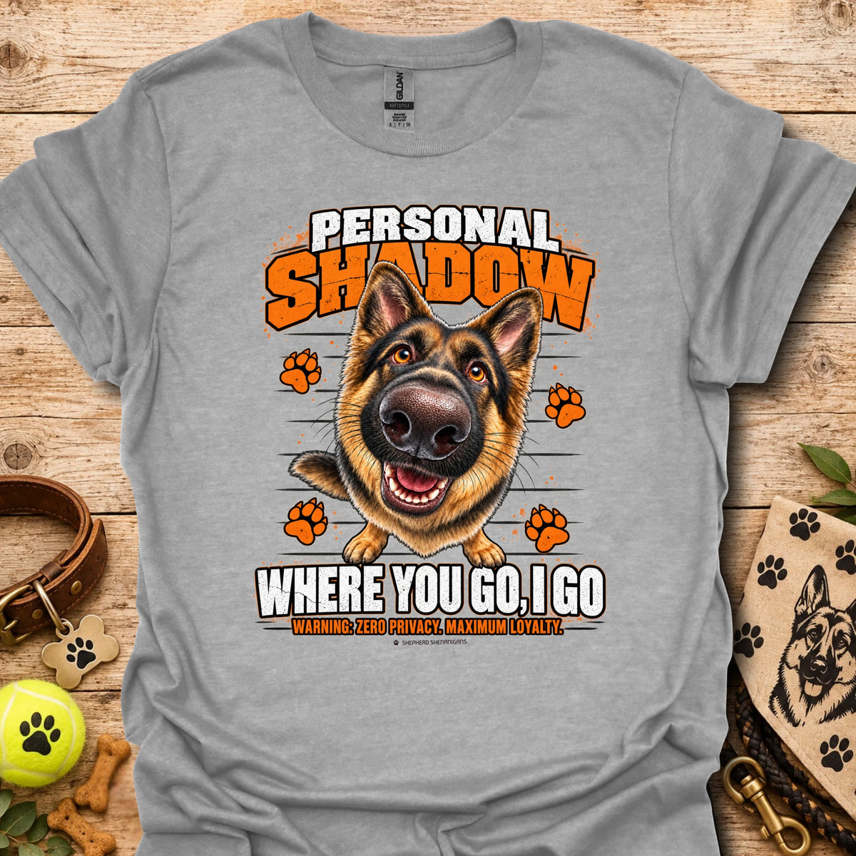 Sport gray T-shirt with a German shepherd graphic, orange paw prints and bold slogan