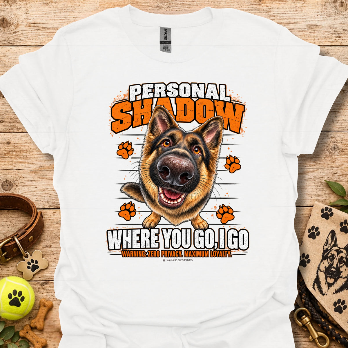 White T-shirt with a German shepherd graphic, orange paw prints and bold slogan