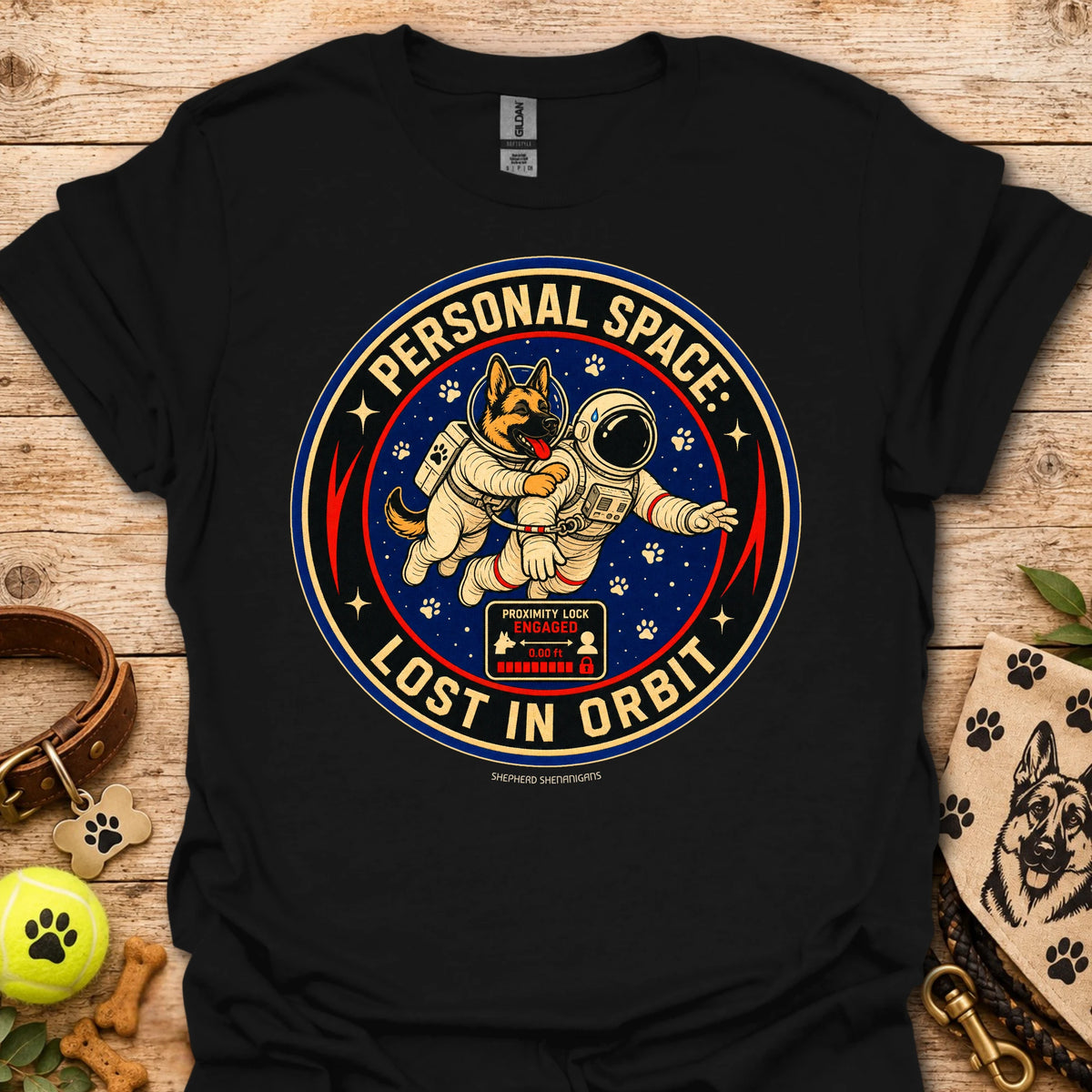 Black t-shirt with astronaut dog graphic and circular 'Lost in Orbit' text