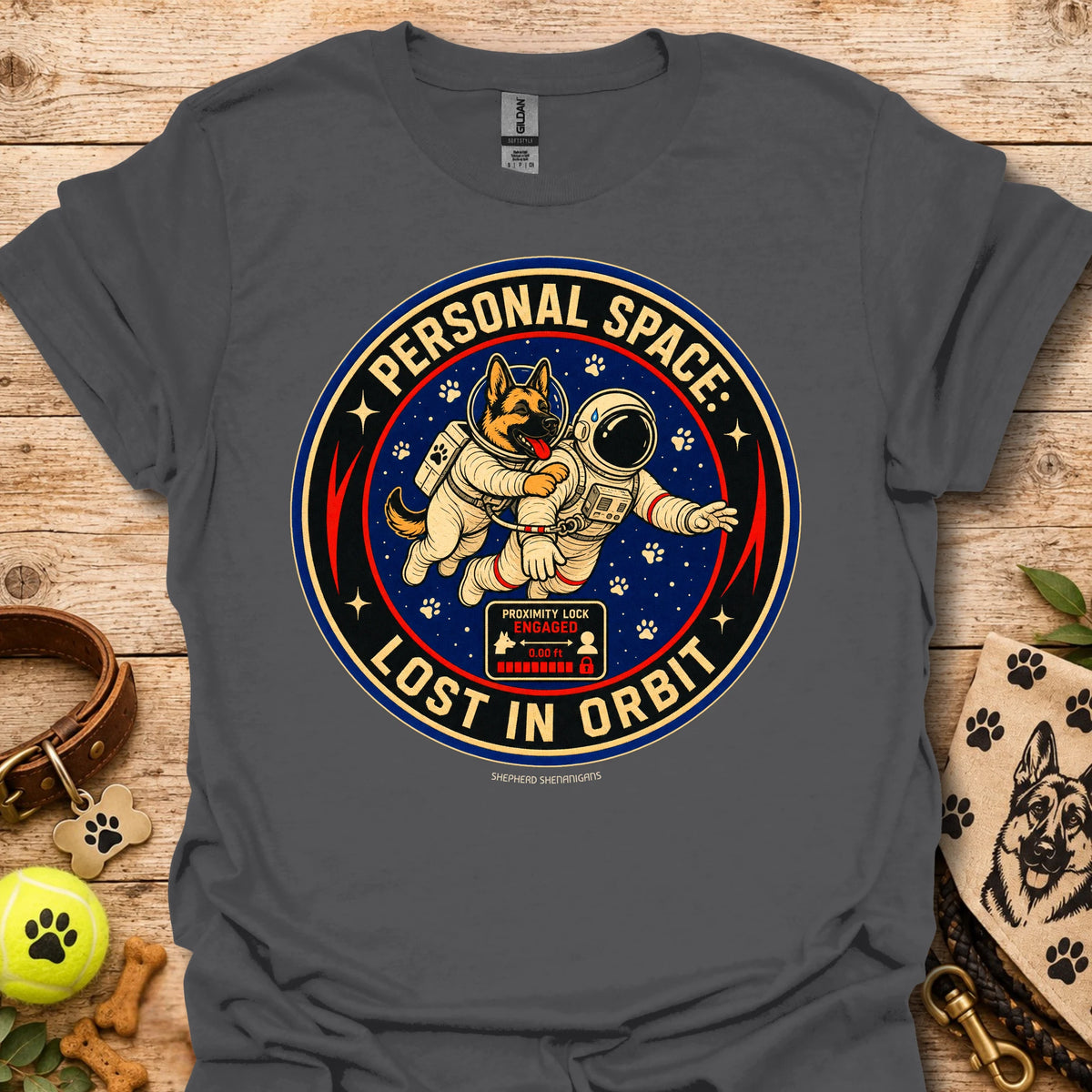 Dark gray t-shirt with astronaut dog graphic and circular 'Lost in Orbit' text
