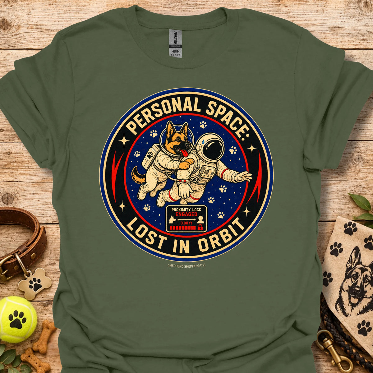Military green t-shirt with astronaut dog graphic and circular 'Lost in Orbit' text