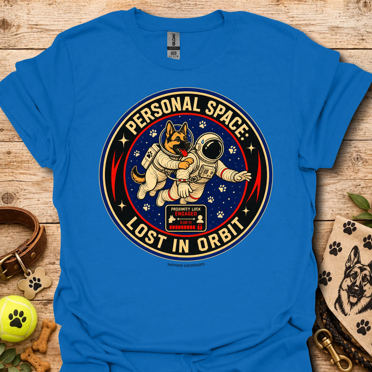 Royal blue t-shirt with astronaut dog graphic and circular 'Lost in Orbit' text