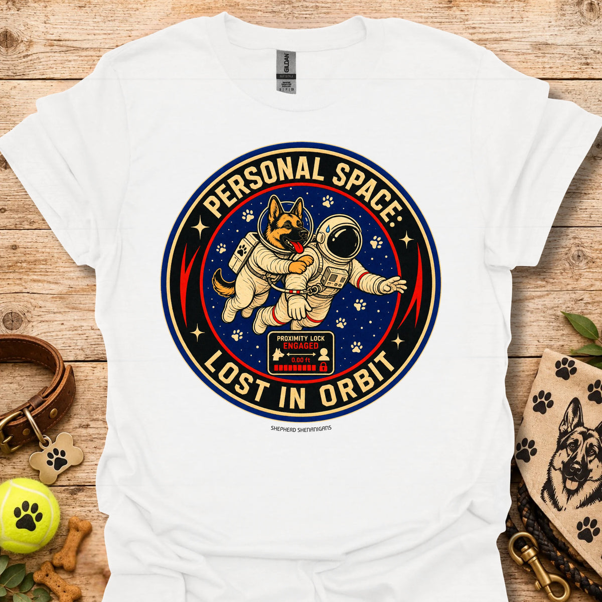 White t-shirt with astronaut dog graphic and circular 'Lost in Orbit' text