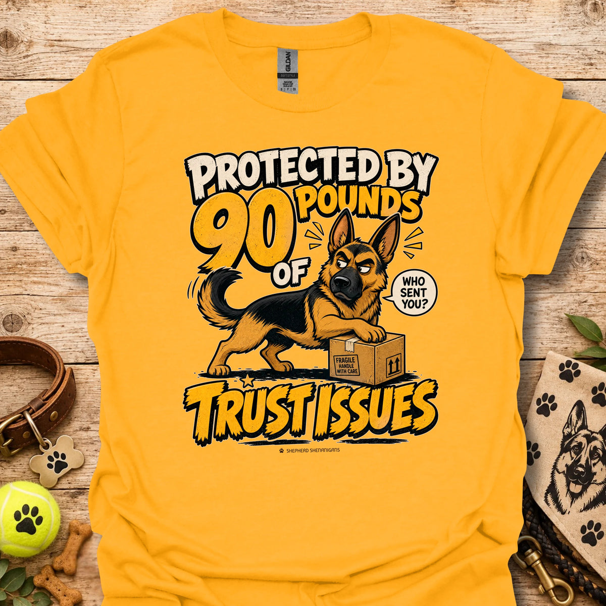 Gold T-shirt with a German shepherd graphic and “Protected by 90 Pounds of Trust Issues” text