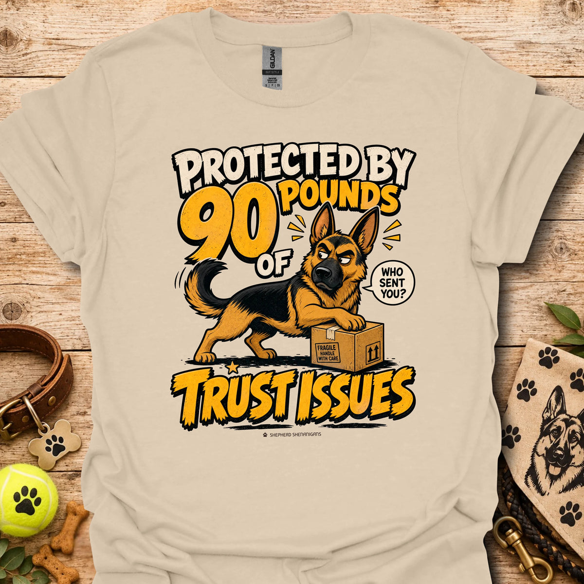 Sand T-shirt with a German shepherd graphic and “Protected by 90 Pounds of Trust Issues” text