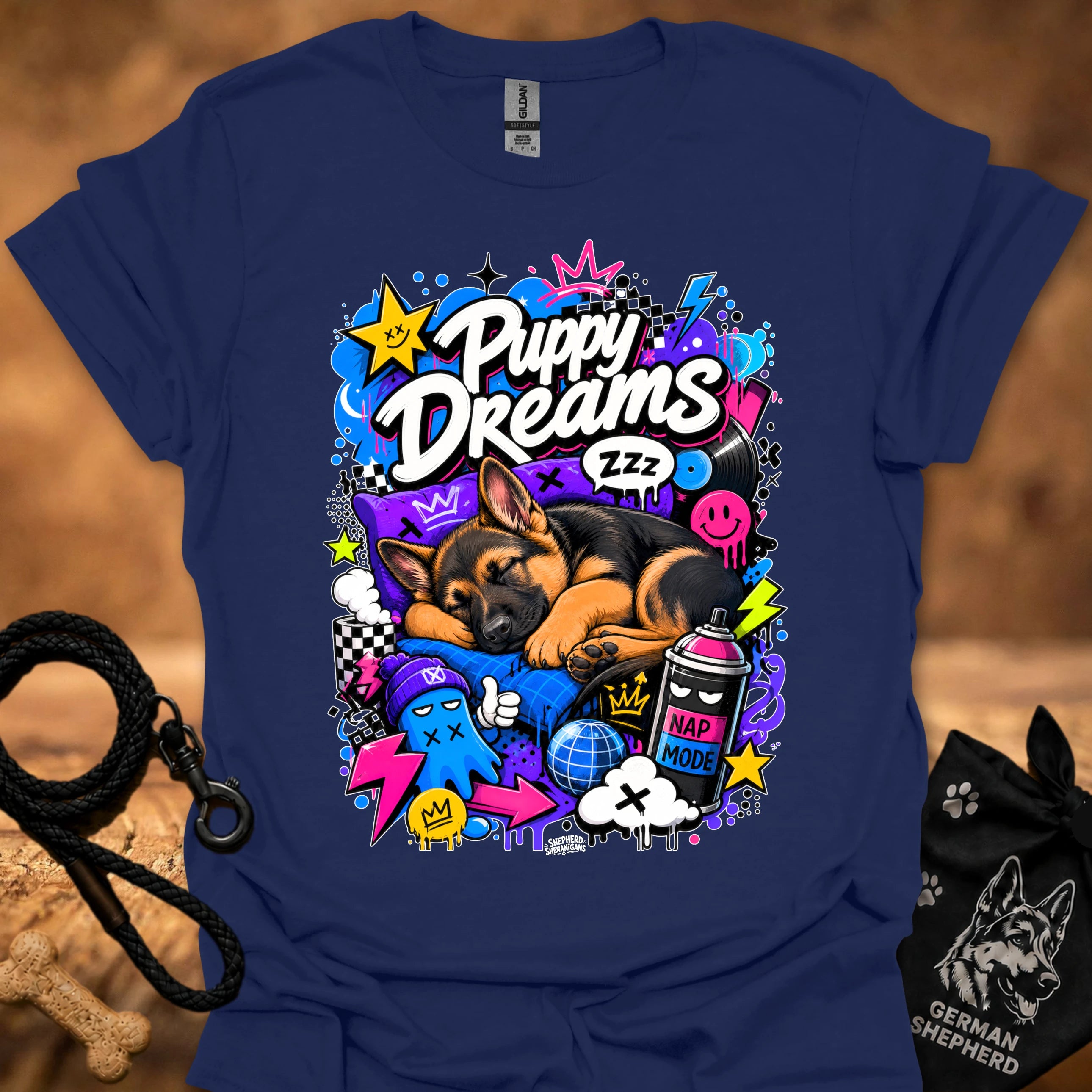 Navy blue T-shirt with colorful Puppy Dreams graphic of a sleeping puppy and icons.