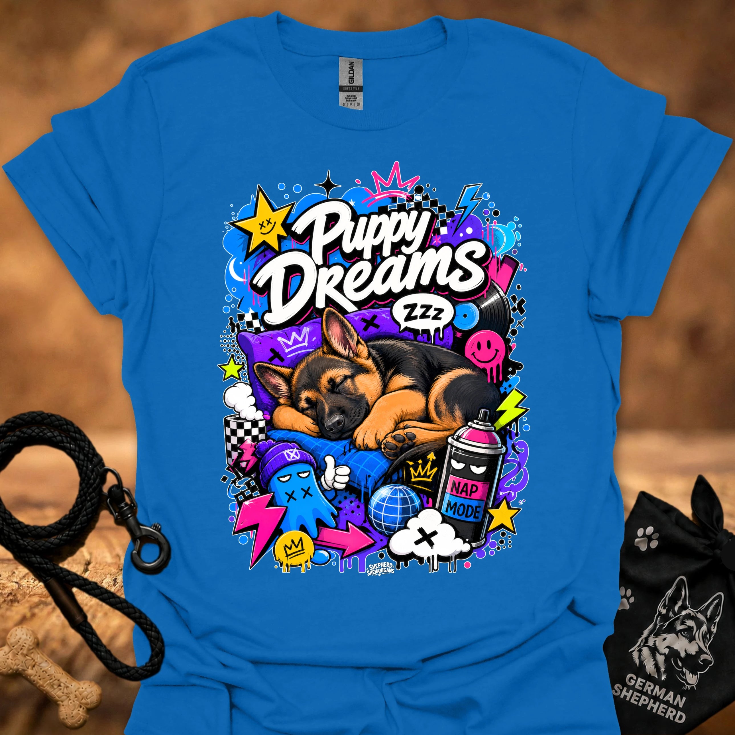 Royal blue T-shirt with colorful Puppy Dreams graphic of a sleeping puppy and icons.